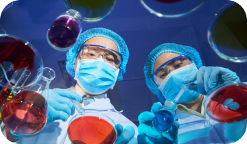 Researchers examining botanical extracts in a lab